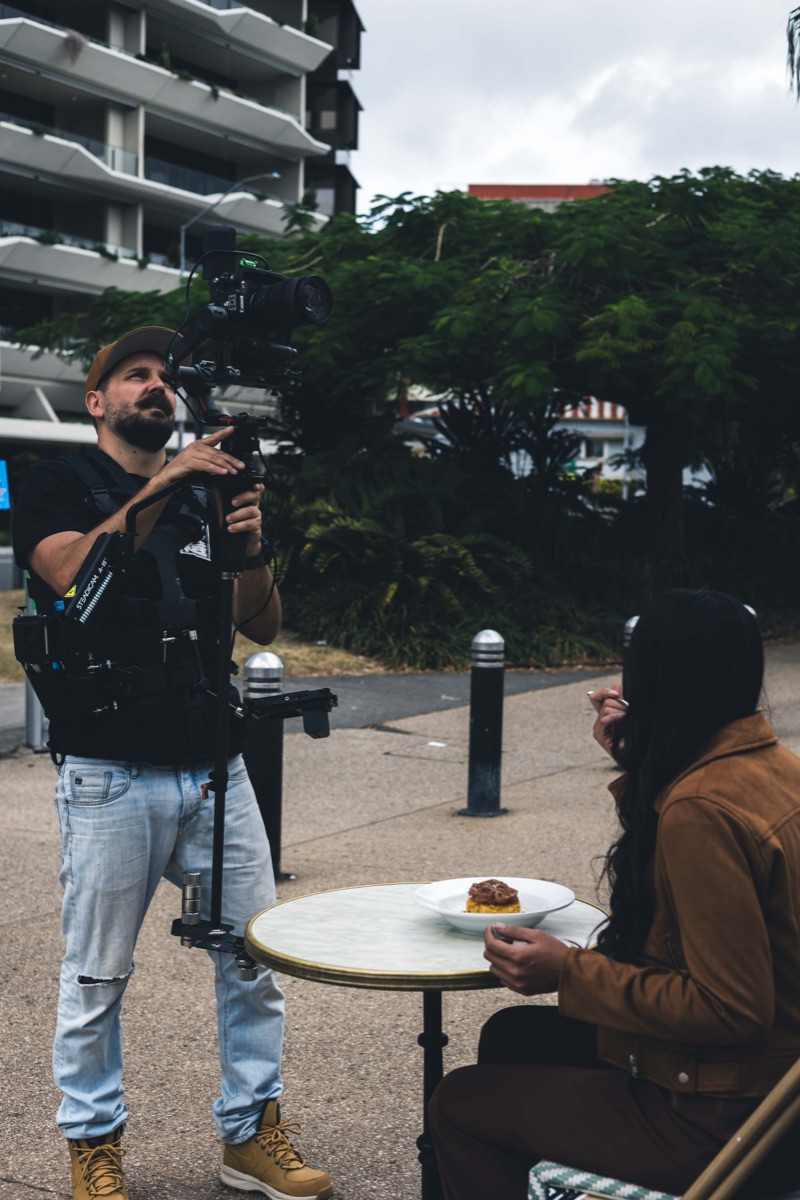 Demetri Conias of Bris.Social operating a Steadicam camera rig on a Joeys Brisbane content shoot.